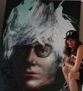 Corno with her Warhol painting (Photo courtesy Galerie Corno)